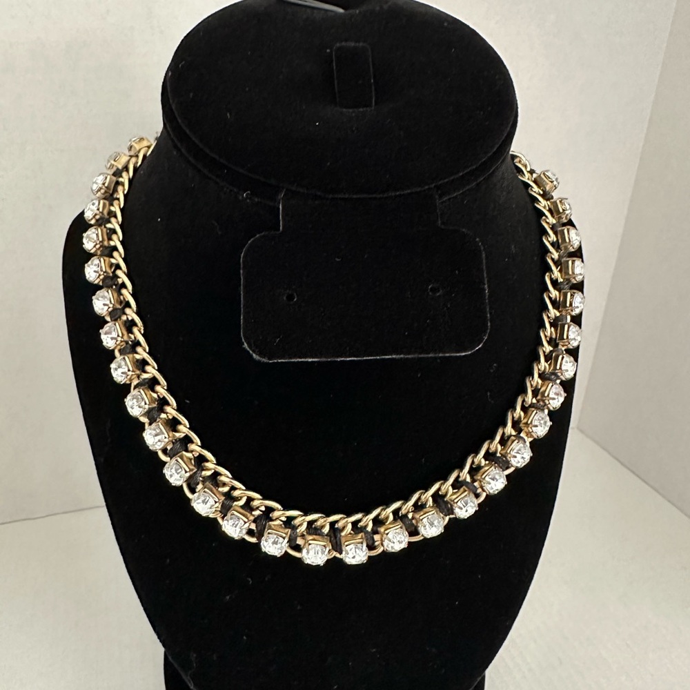Antiqued gold tone chain necklace with clear faceted rhinestones